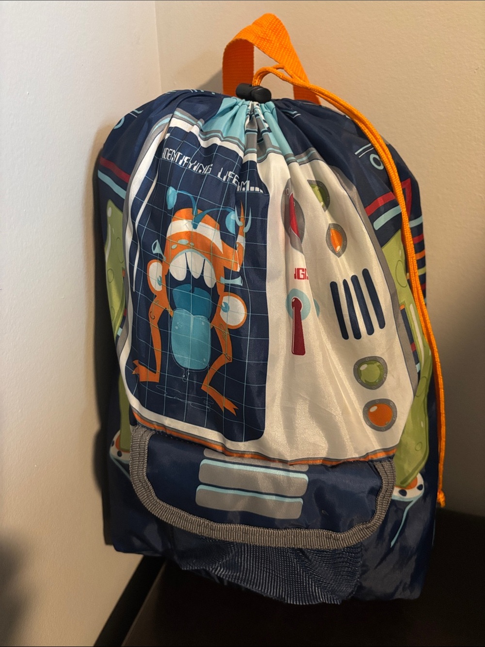 Backpack sleeping bag robot themed with orange straps and drawstring cord